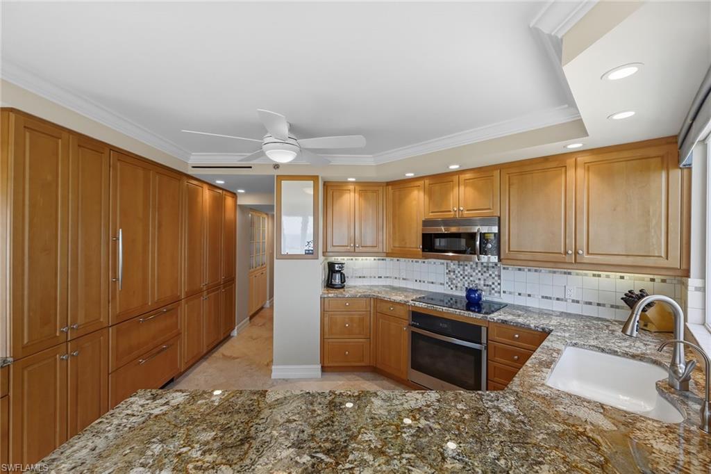 Kitchen with Custom Paneling and Ample Storage