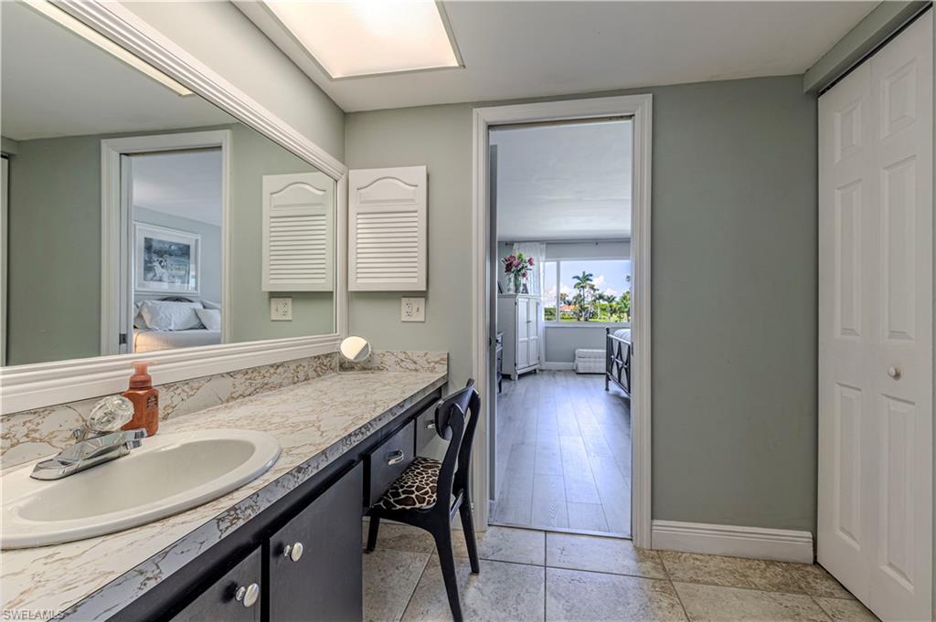 Bathroom with connected bathroom and vanity