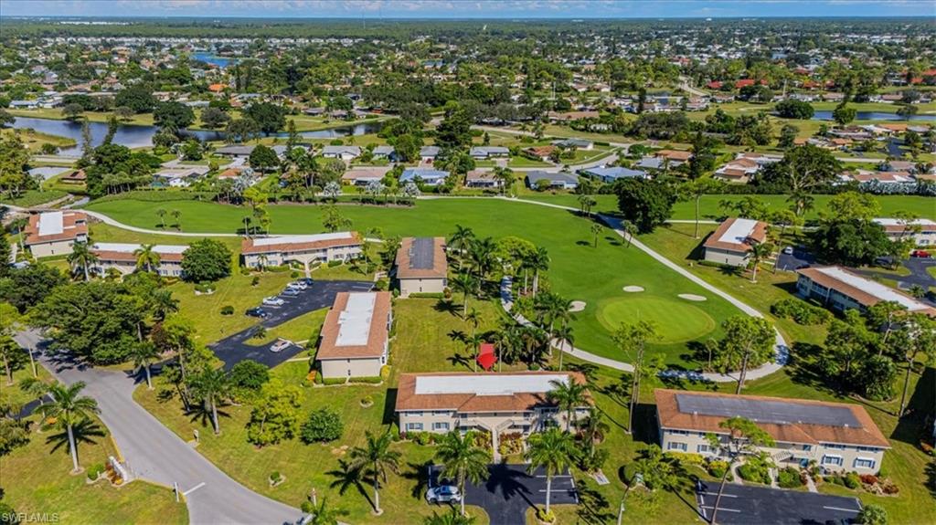 View of property location featuring a nearby body of water and nearby suburban area