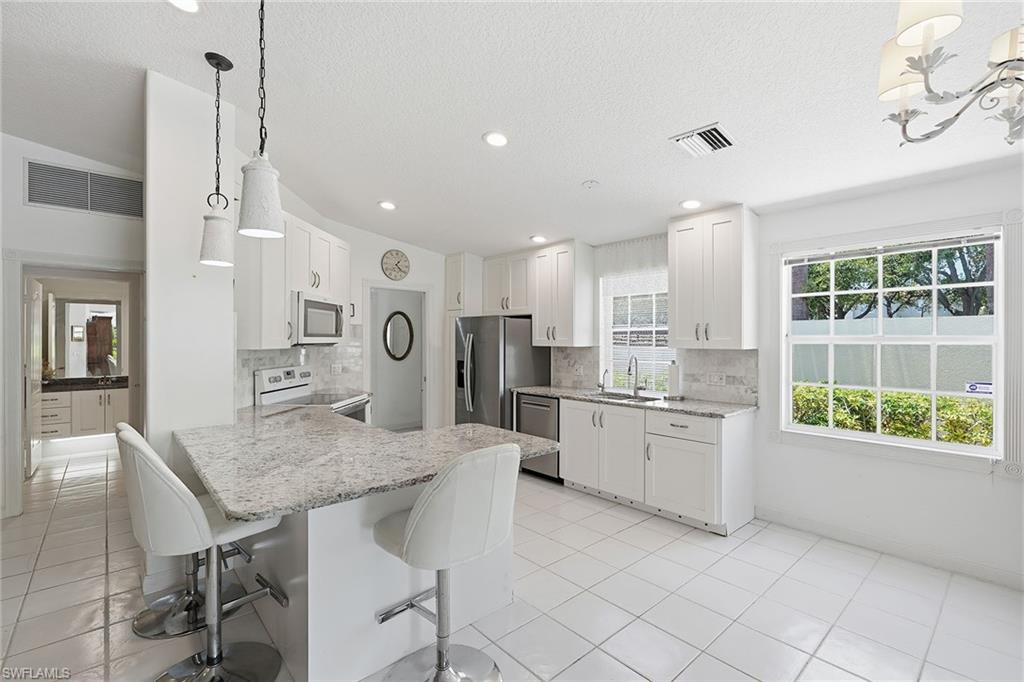Upgraded kitchen with lots of natural light and storage