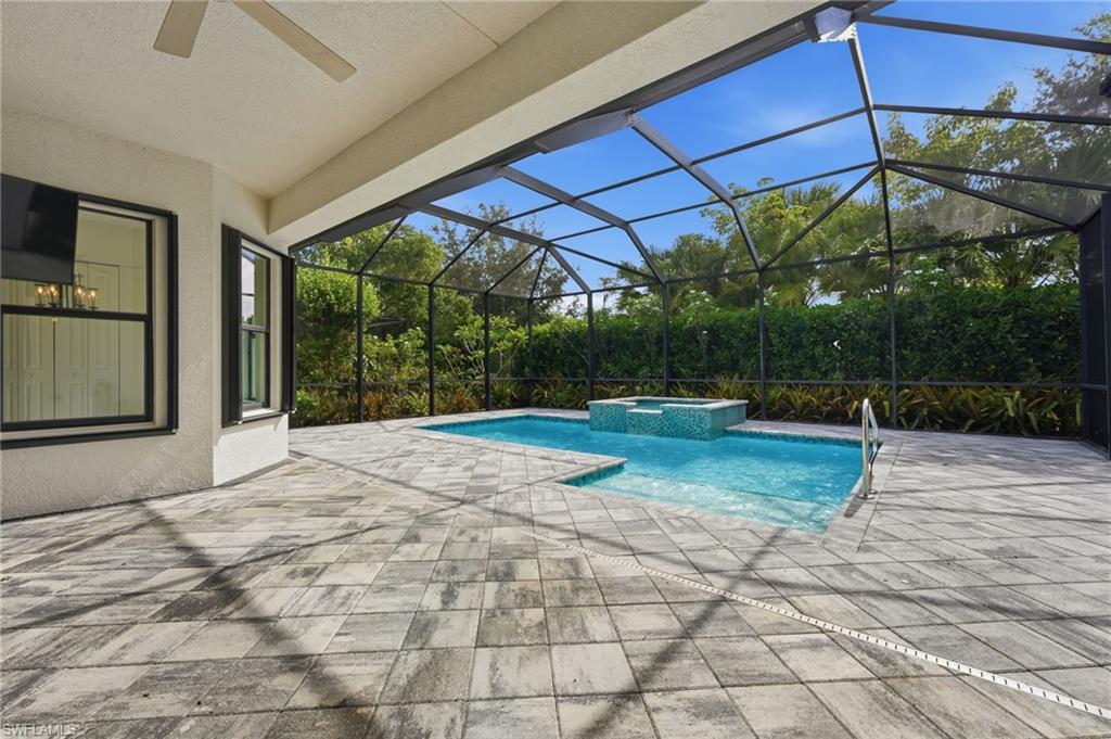 Covered lanai space and pool area.