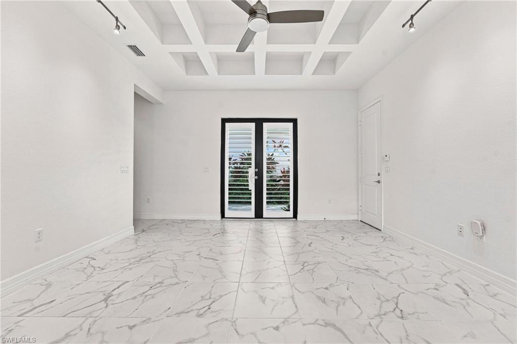 Club room with exterior french doors and access to single car garage