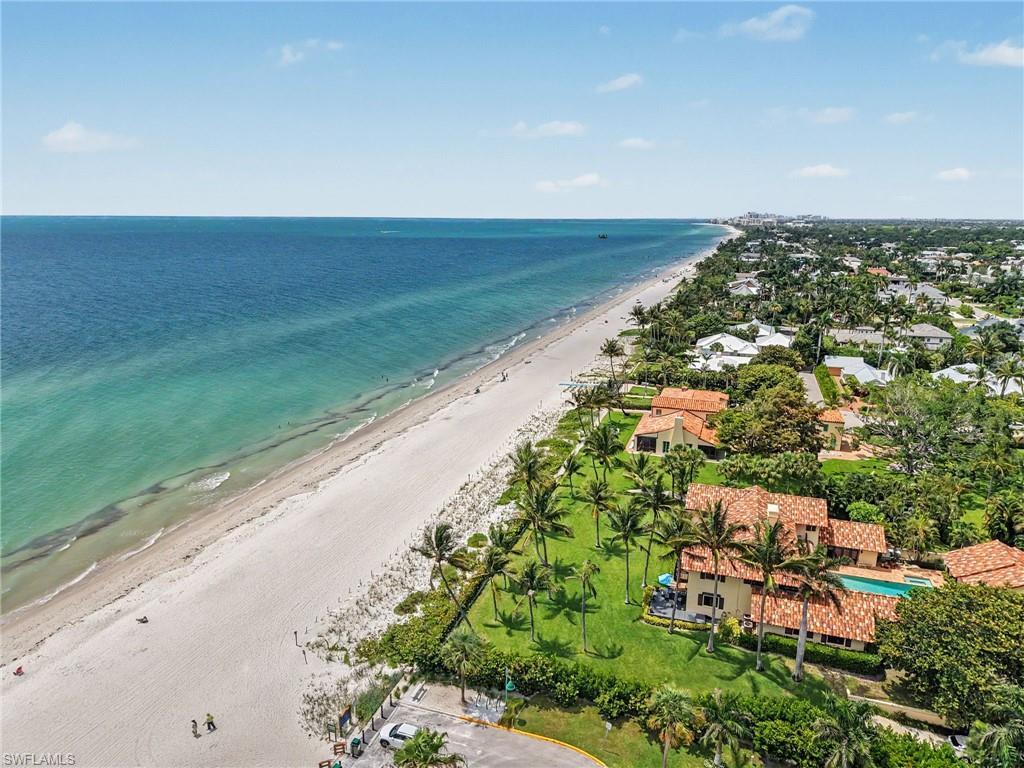 Coastal property with expansive sandy beach frontage and turquoise waters