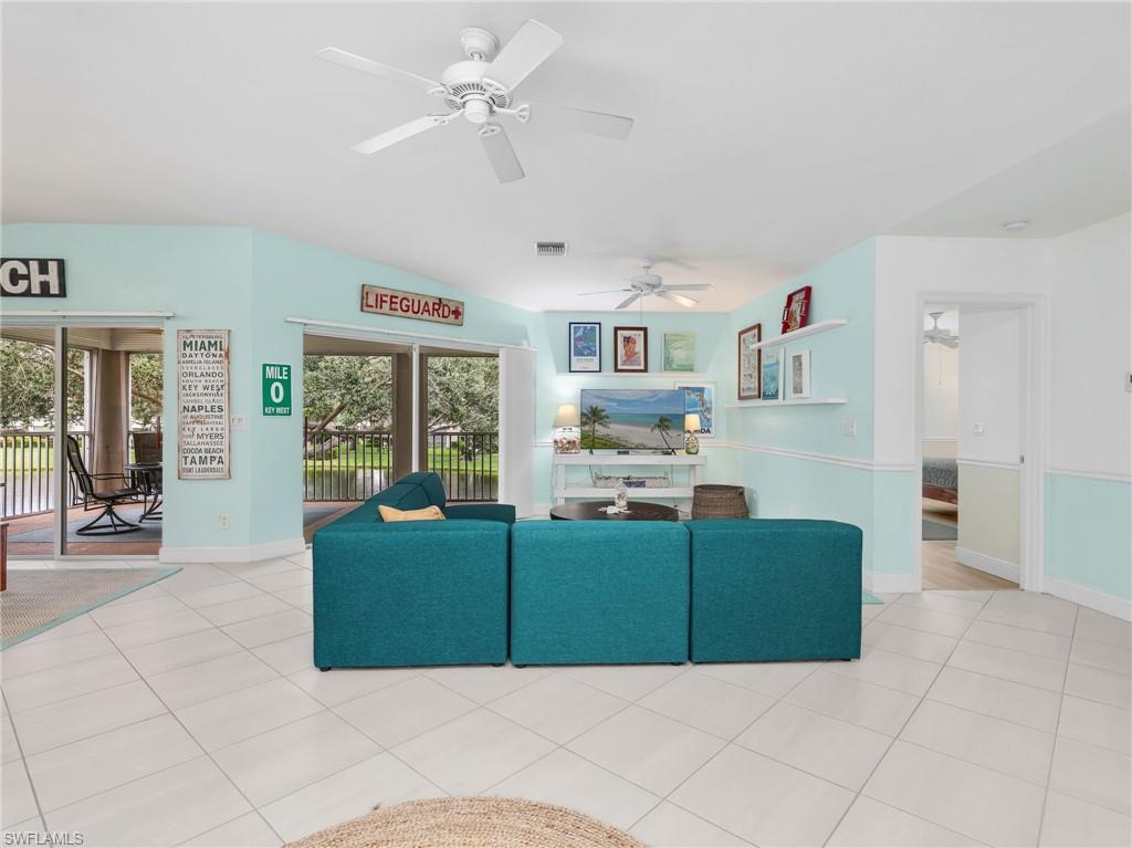 Tiled flooring throughout with multiple ceiling fans