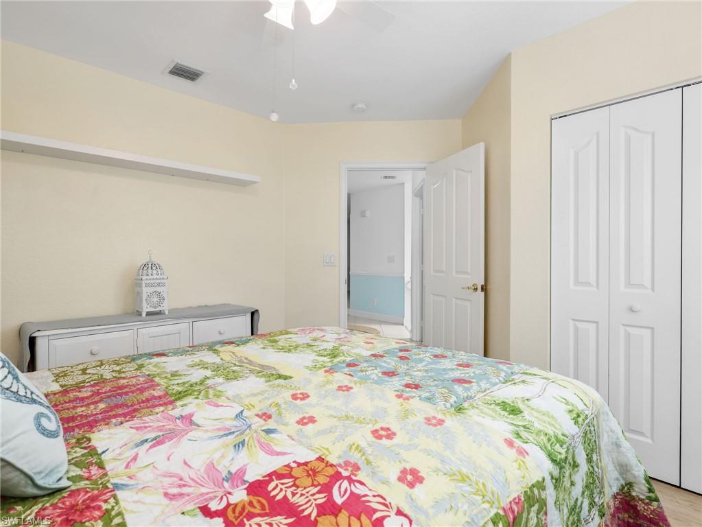 Recessed lighting, ceiling fan, and light-toned walls