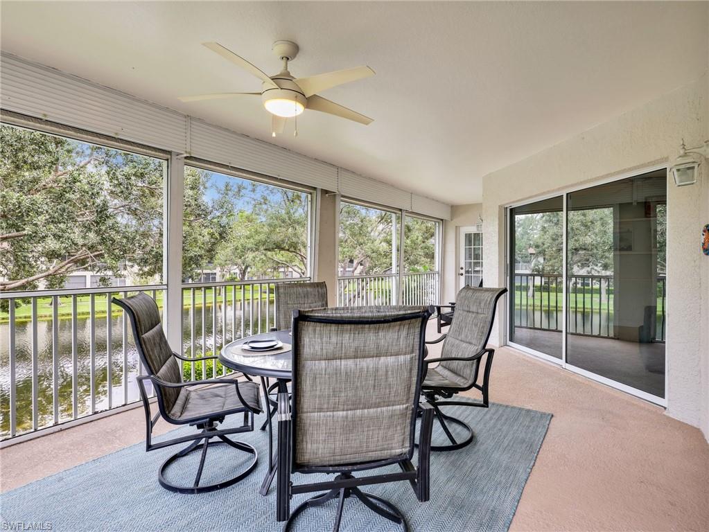 Screened-in patio with ceiling fan and water feature