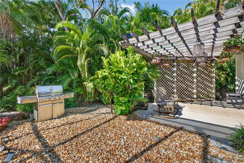 View of yard featuring a pergola and a patio area