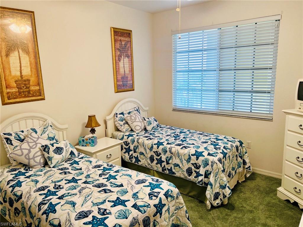 White wood bed frames, a white nightstand, and a white dresser