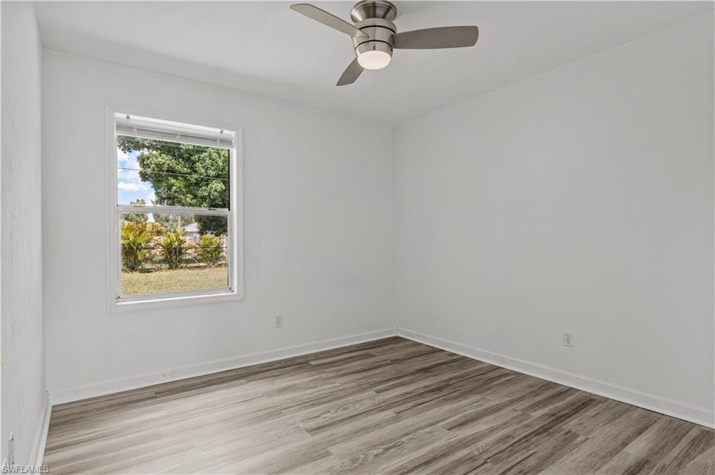 Bedroom with ceiling fan and light hardwood / wood-style floors
