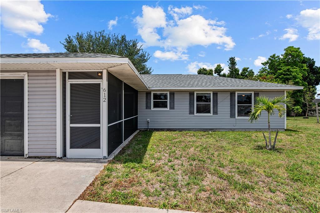Front of home with screened in entry