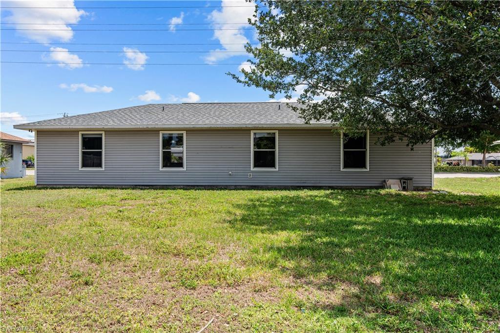 Back of house with a a large backyard