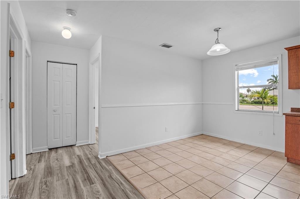 Spare room with tile floors
