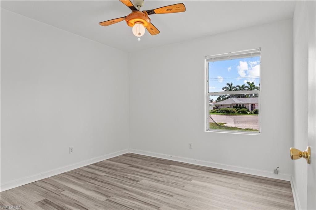 Bedroom featuring ceiling fan and light wood-type flooring