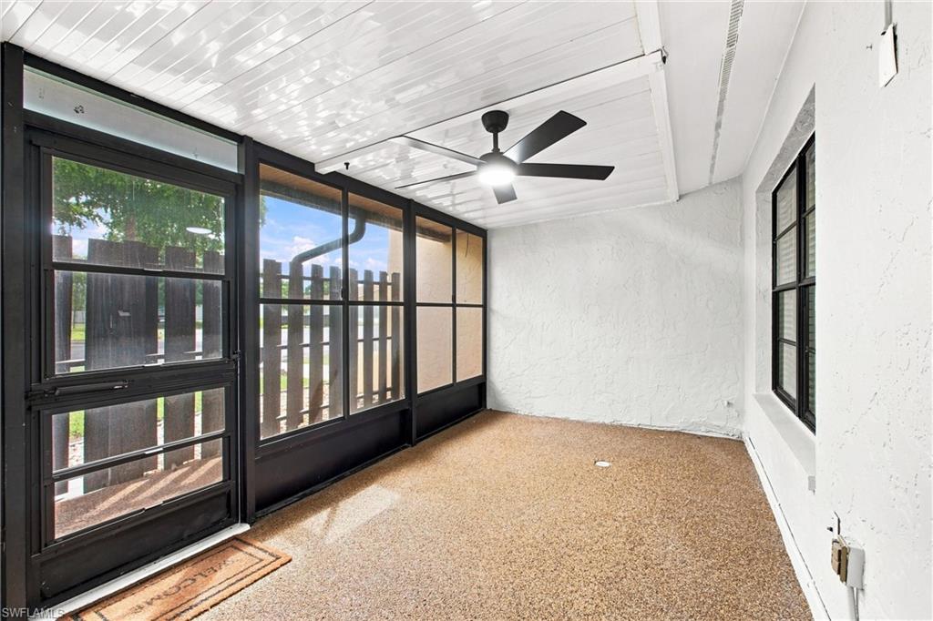 Enjoy outdoor living in the spacious screened-in lanai featuring a contemporary ceiling fan and dual sliding glass sealed windows.