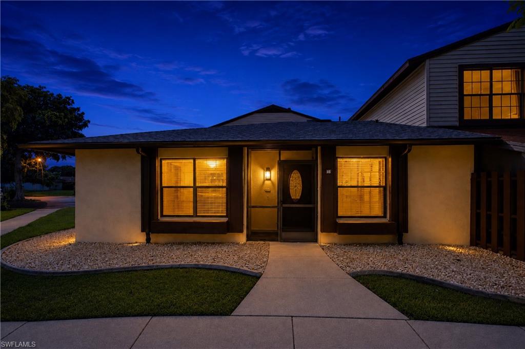 Spectacular twilight view highlighting the warm, cozy atmosphere and well-lit entry porch welcoming you inside.