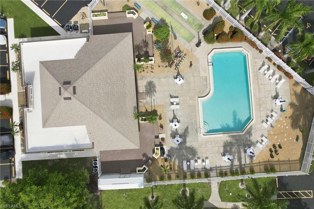 Resort-style living! Dip into the sparkling community swimming pool featuring expansive sun decks, lounge seating, and a dual shuffle court.