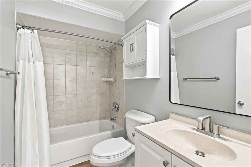 Immaculate second bathroom comes complete with a quartz top vanity, over-the-toilet storage cabinet, and a clean tub/shower combo.