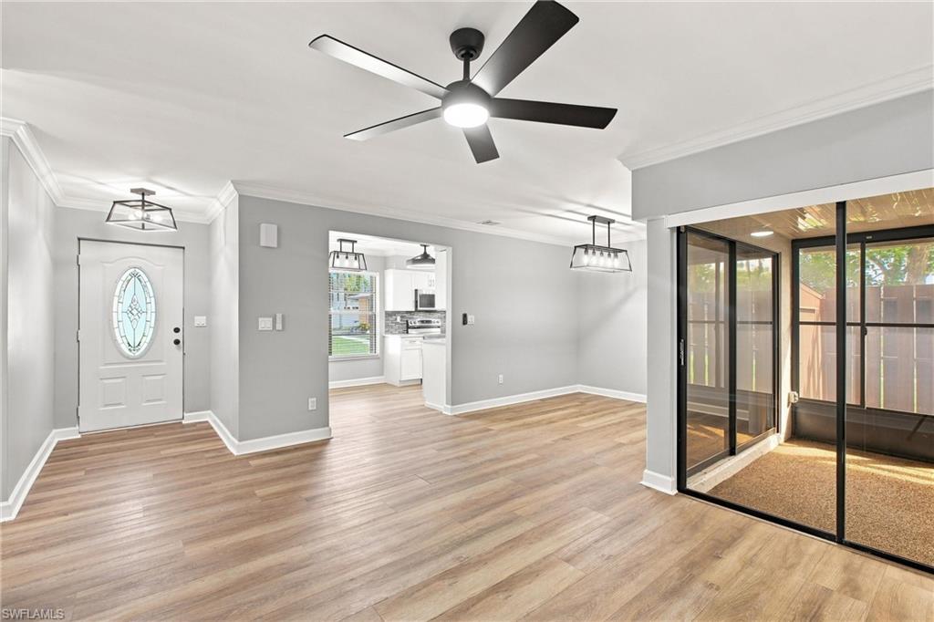 Alternate view of the expansive living space highlighting the neutral paint palette, clean lines, and smooth flooring throughout.