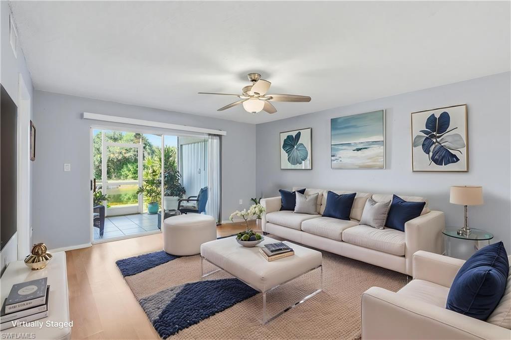 LIVING AREA EXTENDING TO OUTDOOR LIVING SPACE...VIRTUALLY STAGED.