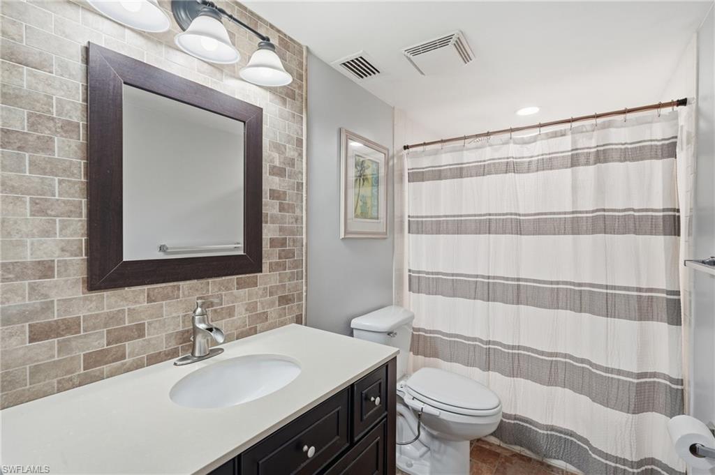 ENSUITE BATH WITH MODERN UPDATED VANITY,  ACCENT WALL AND LIGHTING...