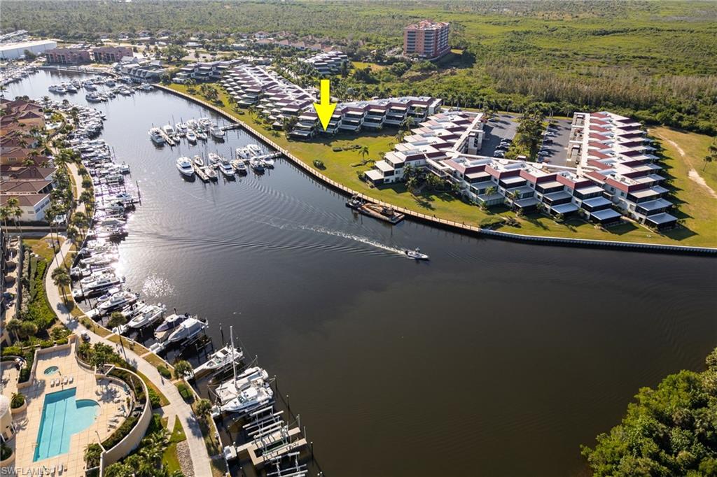 Aerial perspective of a waterfront community featuring canal access
