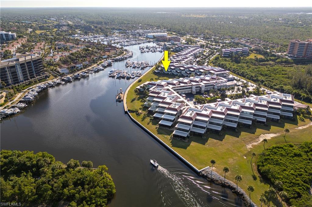 Aerial perspective showcasing a waterfront community with direct marina access