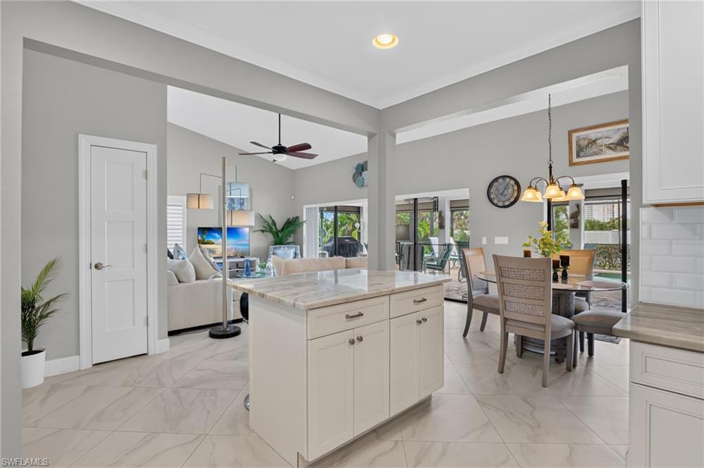 Open concept interior featuring vaulted ceilings and recessed lighting