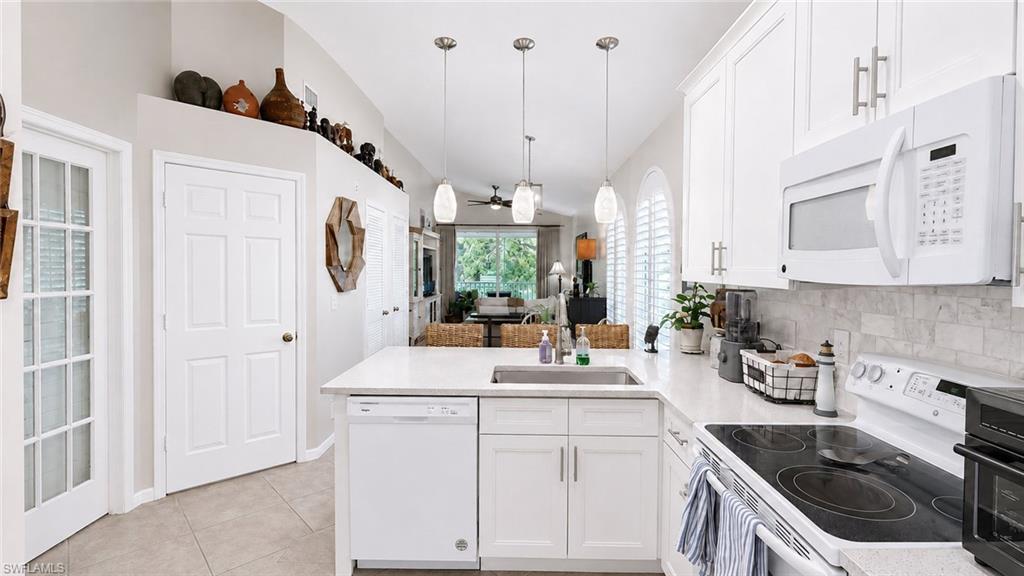 Arched windows with plantation shutters