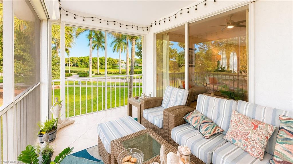 Screened-in porch featuring a ceiling fan and tiled flooring