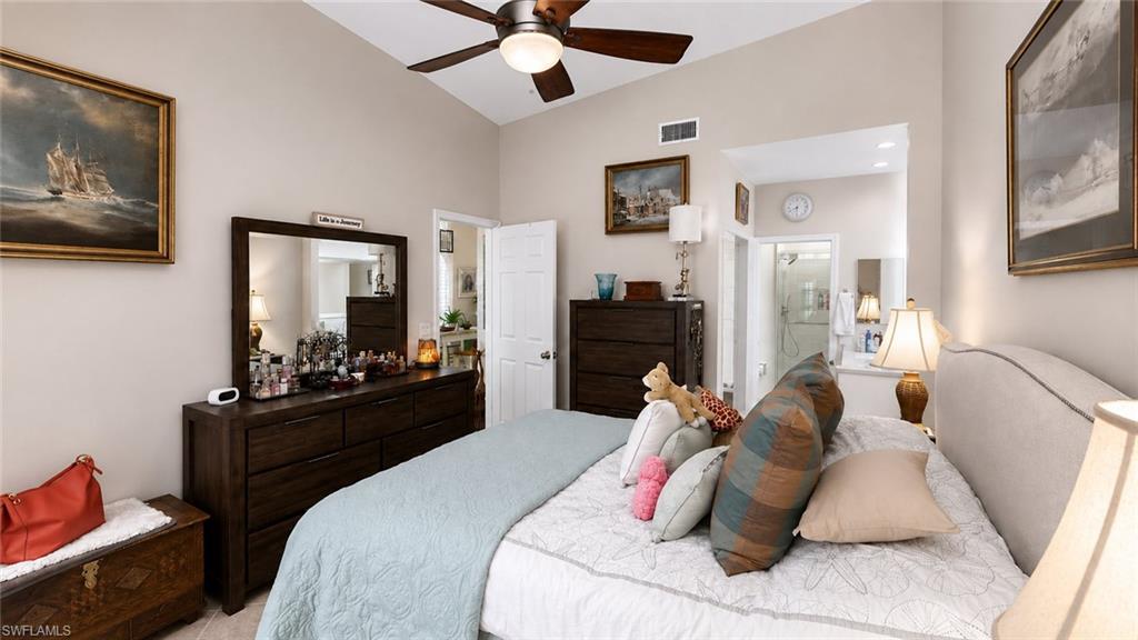 Vaulted ceiling with a ceiling fan, recessed lighting, and tile flooring