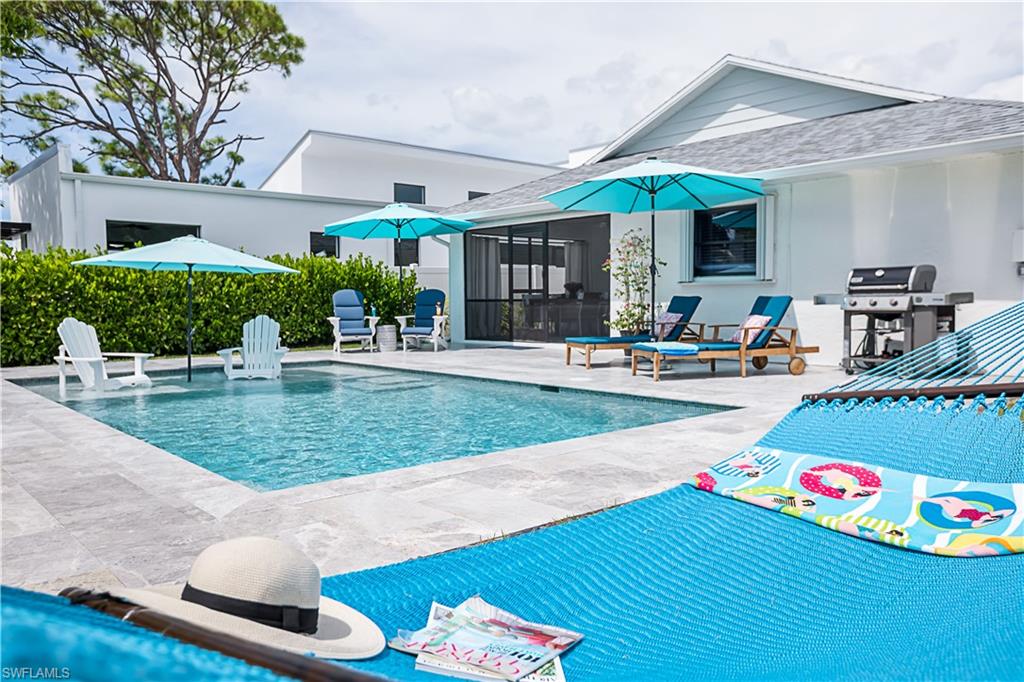Pool Area with Generous Patio, Two Hammocks, Chaise Lounges and Seating