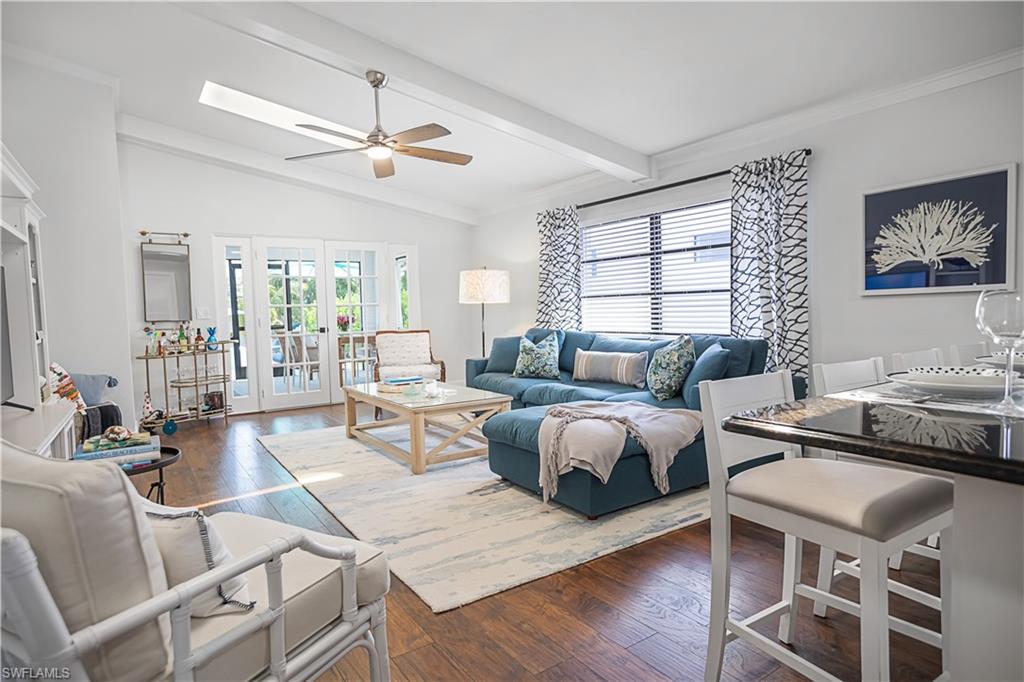 Family Room with Vaulted Ceiling, Skylights and French Doors to Screened Lanai