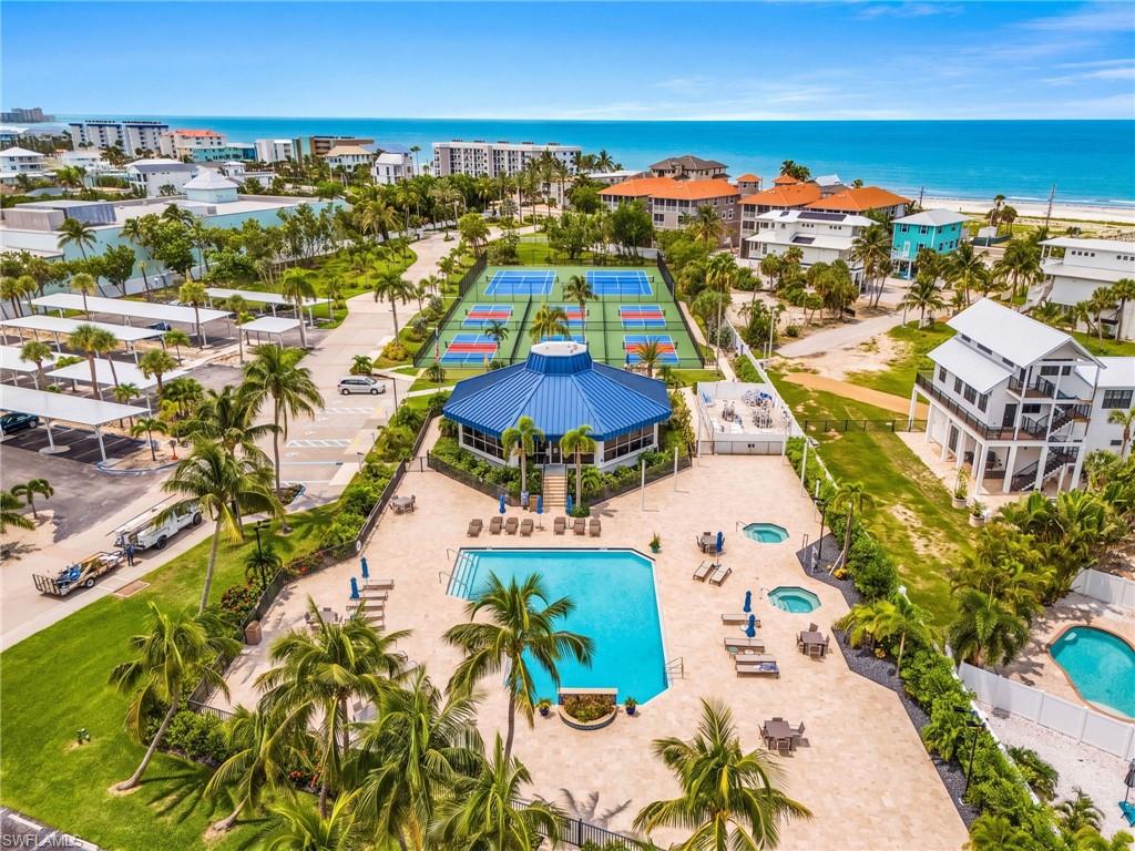 MOST INVITING POOL AREA.  BEAUTIFUL TENNIS AND PICKLEBALL AREA IN THE BACKGROUND.