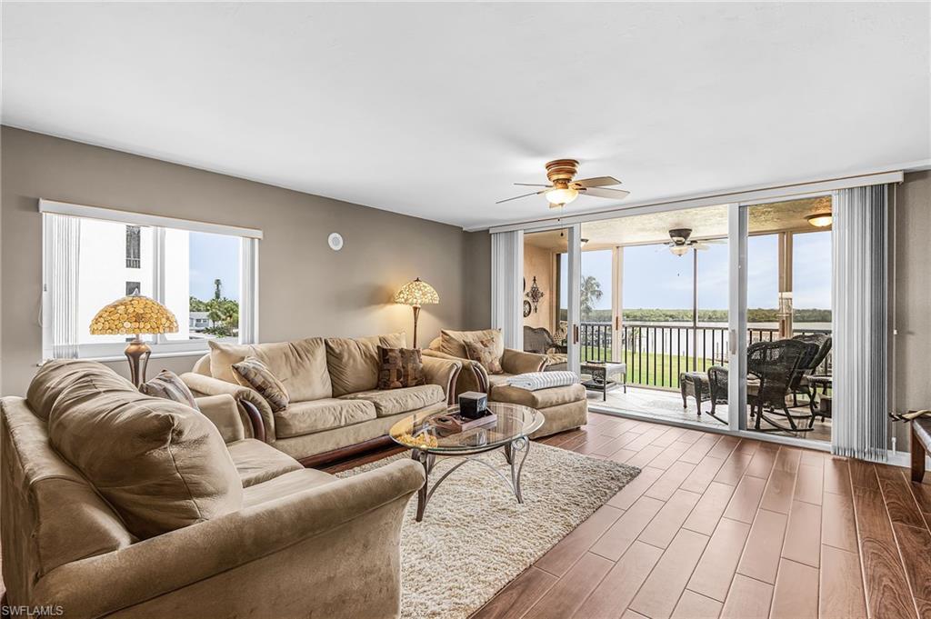 SOLID SURFACE FLOORS IN THIS LIGHT AND BRIGHT END UNIT CONDO.