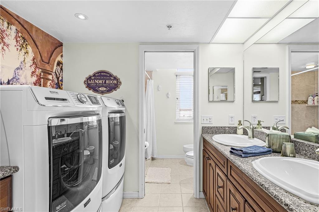 MASTER BATH INCLUDES NEW WASHER AND DRYER SETUP, TWIN SINKS AND SOLID SURFACE FLOORS AND COUNTERS.