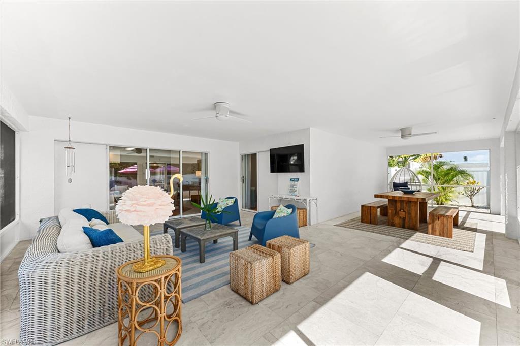 Living room featuring a ceiling fan