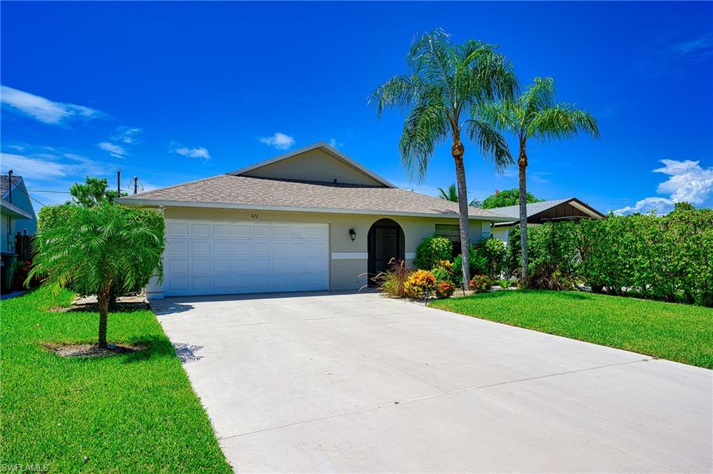Landscaped Front Yard and 2 Car Garage