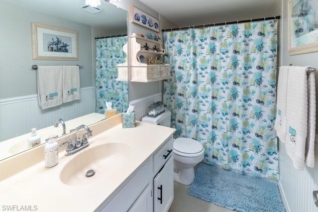 White vanity with chrome fixtures and integrated sink