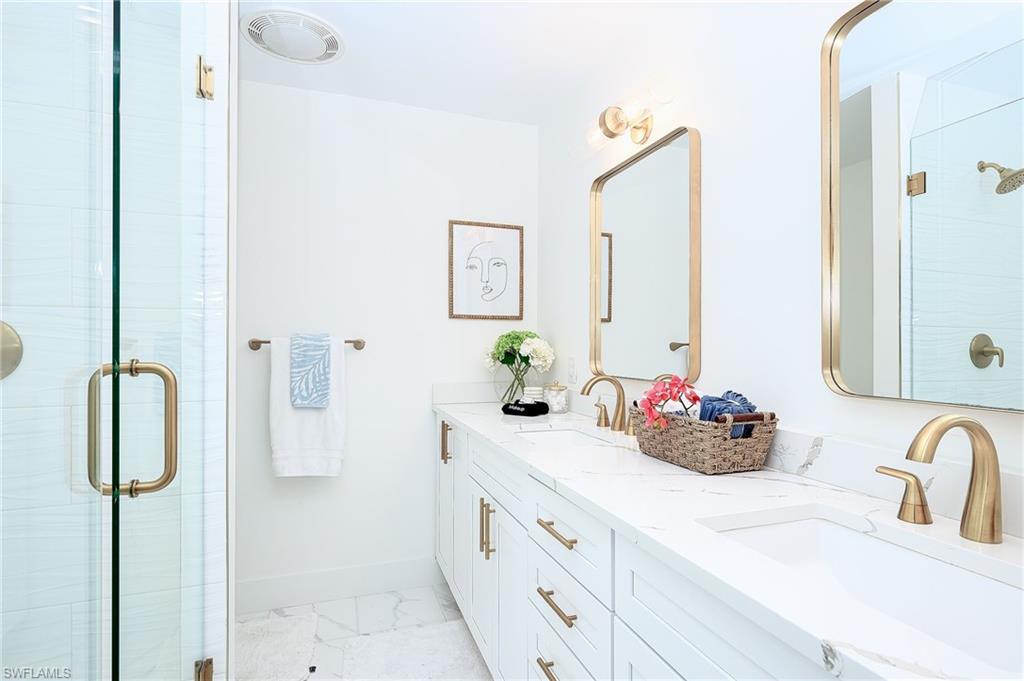 Bathroom with walk in shower and vanity