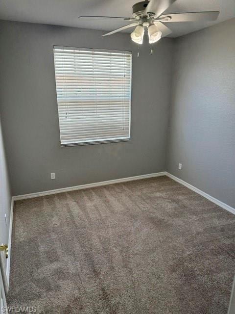 Wall-to-wall carpeting with light gray walls, window with blinds, and a ceiling fan with integrated lighting