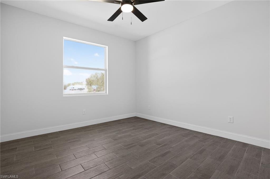 Recessed window with white trim, wood-finish tile flooring, ceiling fan with integrated lighting, and white painted walls
