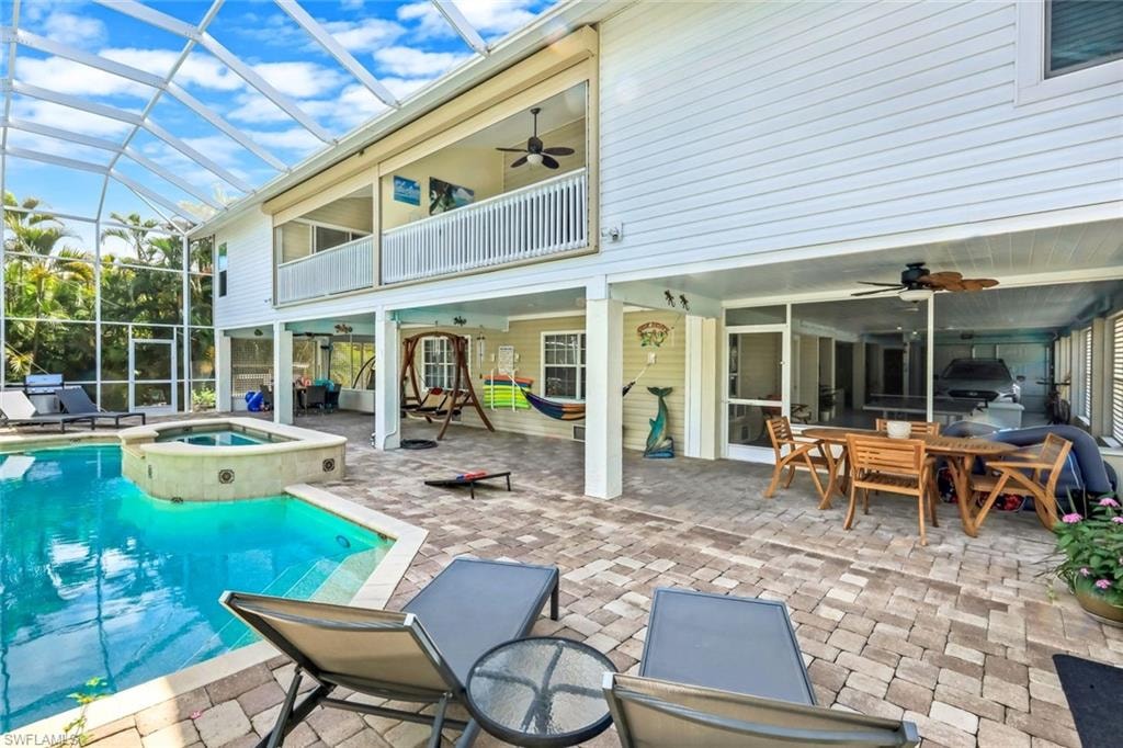Screened enclosure with an integrated pool and raised spa