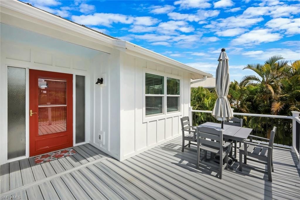 Expansive outdoor deck with composite flooring and white railing