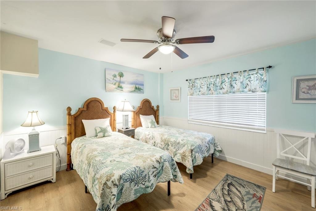 Wood-finish flooring with beadboard wall paneling