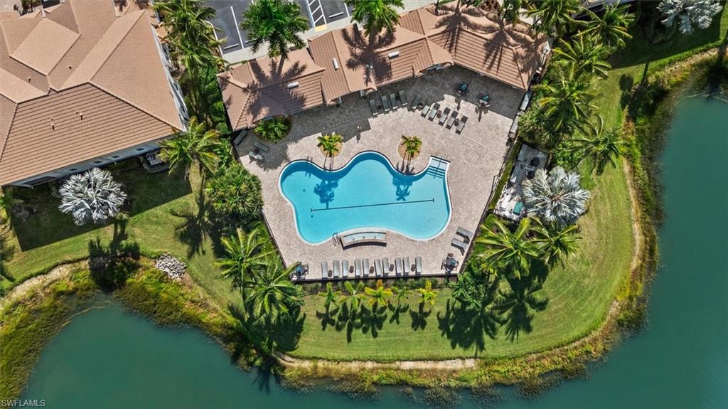Resort-style pool with integrated spa and ample surrounding hardscaping