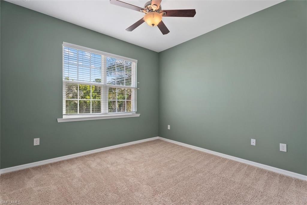2nd Bedroom Wall-to-wall carpeting, multiple electrical outlets, and a ceiling fan with integrated lighting