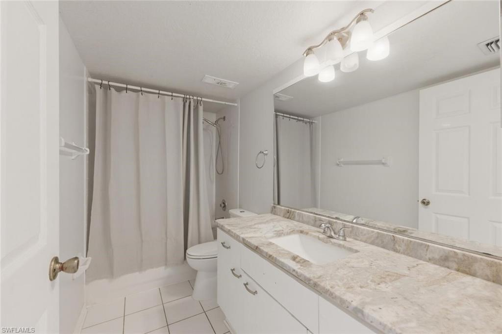 Full Guest bath featuring updated countertops