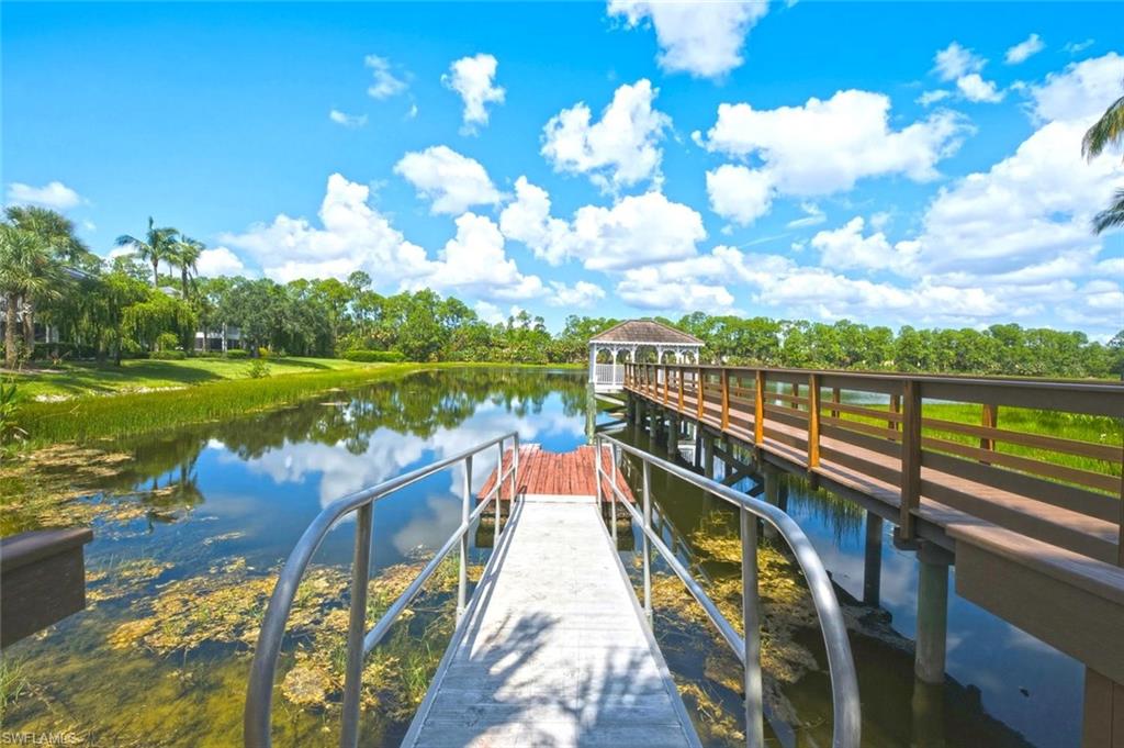 Waterfront access with a private dock and an extended pier leading to a white gazebo