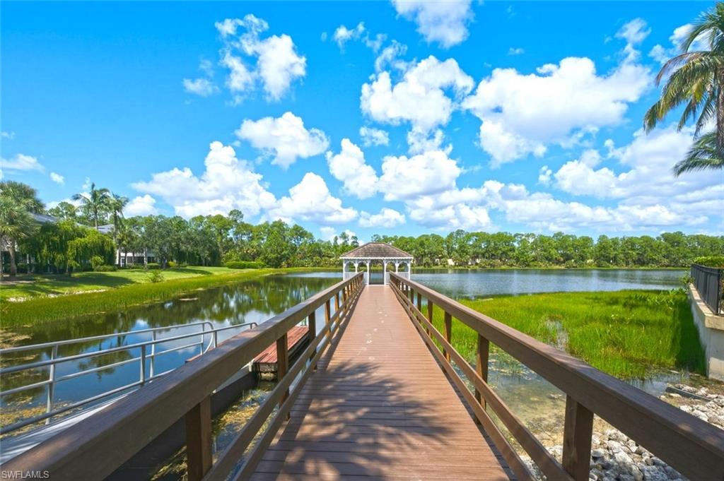 Expansive lake with a private pier and a built-in gazebo