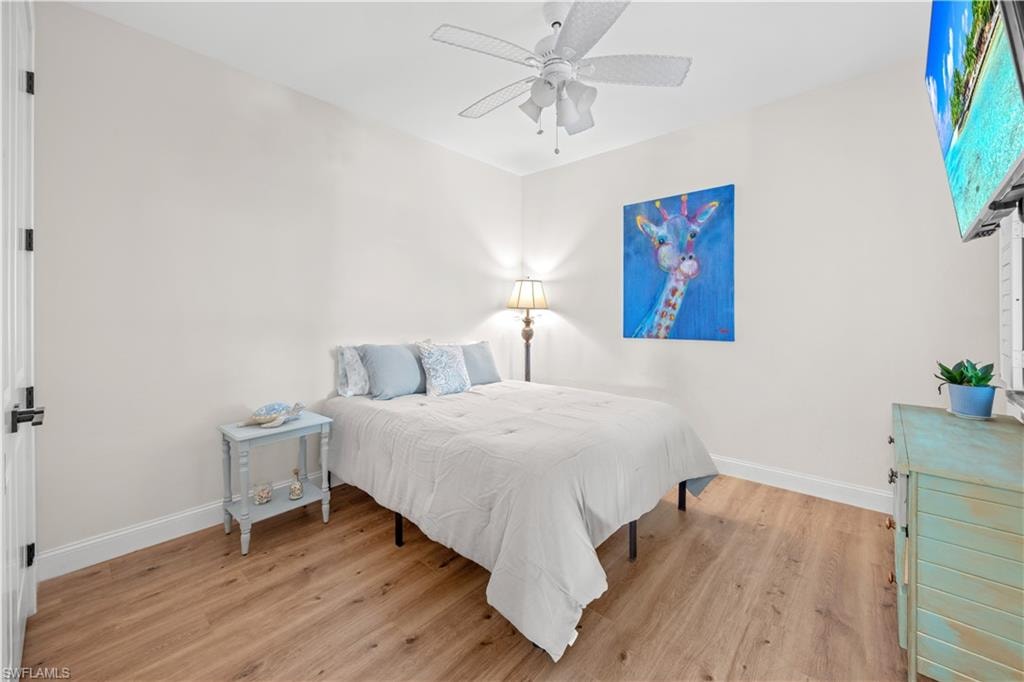 Wood-finish flooring with white baseboards